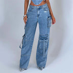 High-waist blue denim cargo pants with utility pockets and relaxed wide-leg fit
