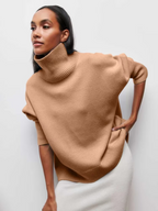 Light brown knitted turtleneck sweater with short sleeves and ribbed cuffs
