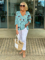 Women's three-quarter sleeve blouse, light blue with floral print and V-neck