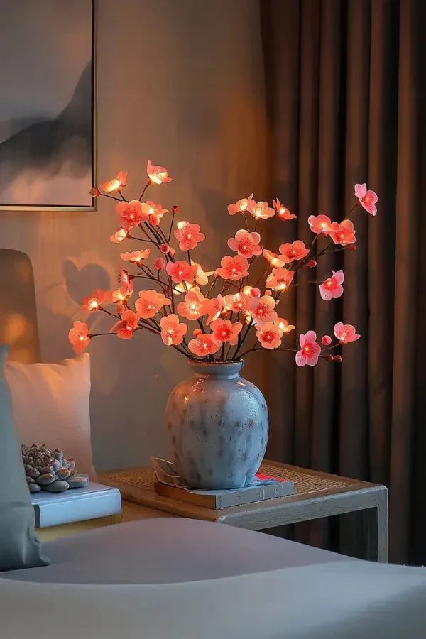 Cherry blossom LED centerpiece with pink flower lights on branches in blue speckled vase