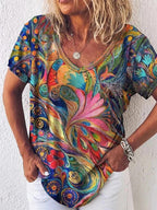 Women's colorful abstract art print v-neck short-sleeve top with bird and floral motifs