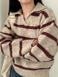 Women’s knit sweater with V-neck, beige base and maroon striped bands