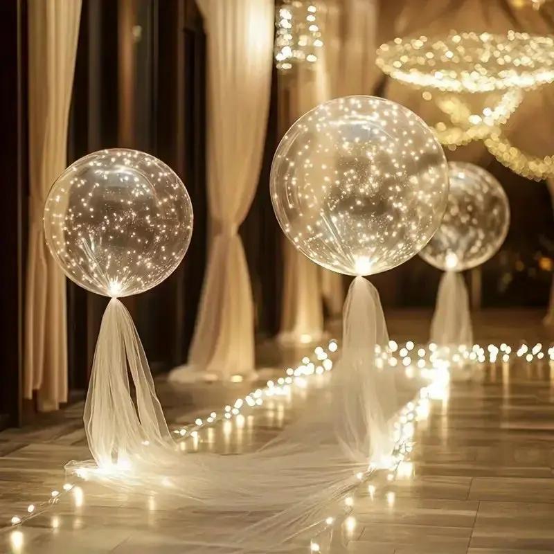 Warm white LED transparent balloons with light strings for an event walkway