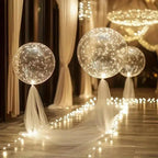 Warm white LED transparent balloons with light strings for an event walkway