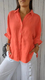 Orange relaxed button-front blouse with rolled sleeves and point collar