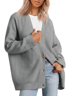 Gray cashmere cardigan with V-neck, ribbed knit texture, button front.