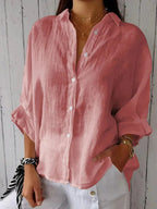 Pink relaxed button-front blouse with point collar and rolled sleeves