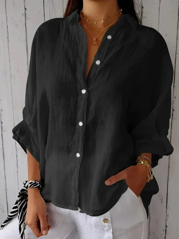 Black relaxed button-front blouse with point collar and rolled sleeves