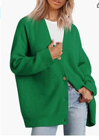 Green cashmere cardigan with V-neck, ribbed knit, button front.