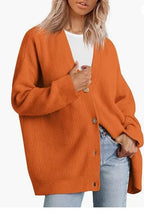 Orange cashmere cardigan with V-neck, ribbed knit, button front.