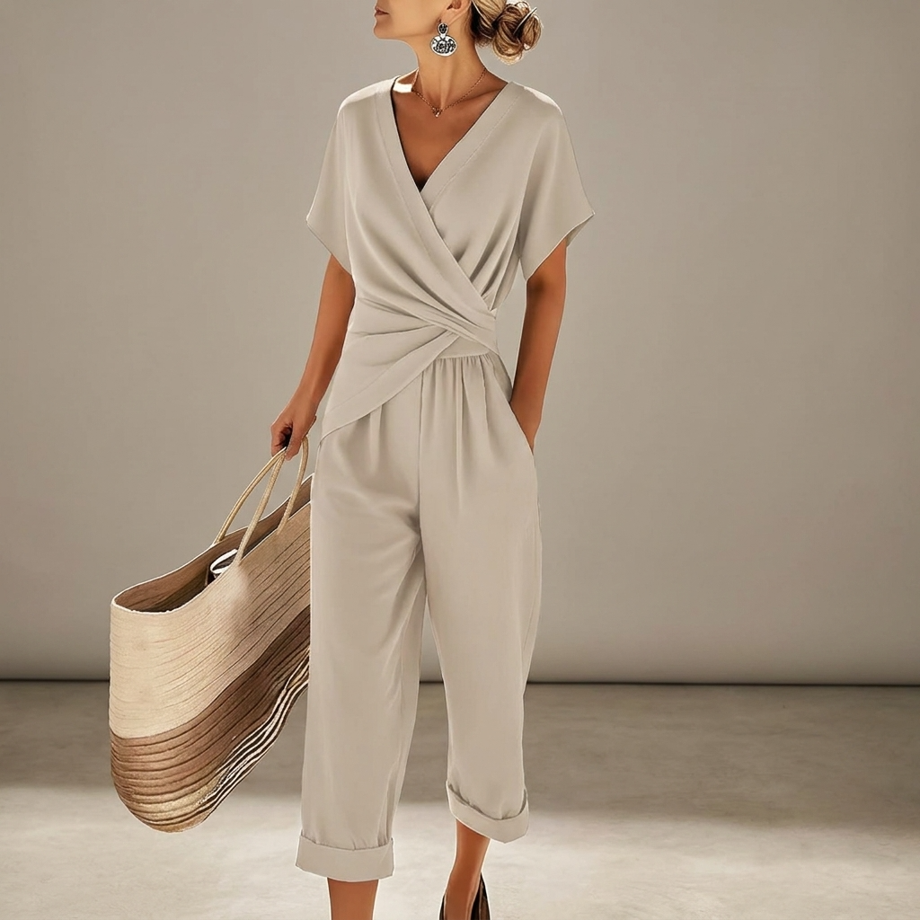 Women’s off-white V-neck jumpsuit with short sleeves, wrap front and tie at waist, cropped wide legs