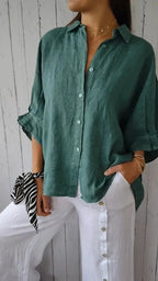 Dark green relaxed button-front blouse with rolled sleeves and point collar