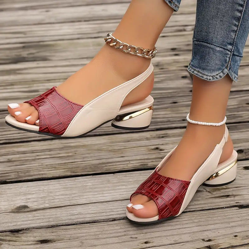 Red open-toe wedge sandals with cream slingback straps and gold-toned heel