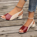 Red open-toe wedge sandals with cream slingback straps and gold-toned heel