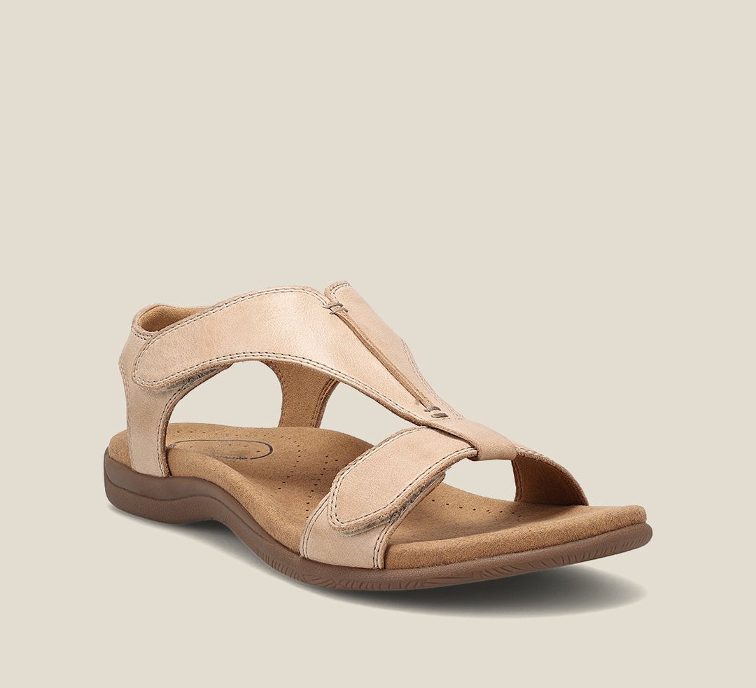 Beige comfort sandals with adjustable cross strap and cushioned footbed