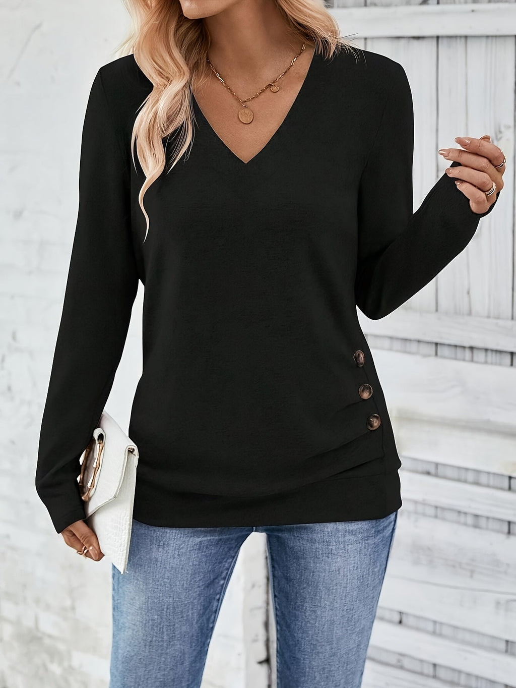 Black women’s V-neck long-sleeve sweater with button side detail