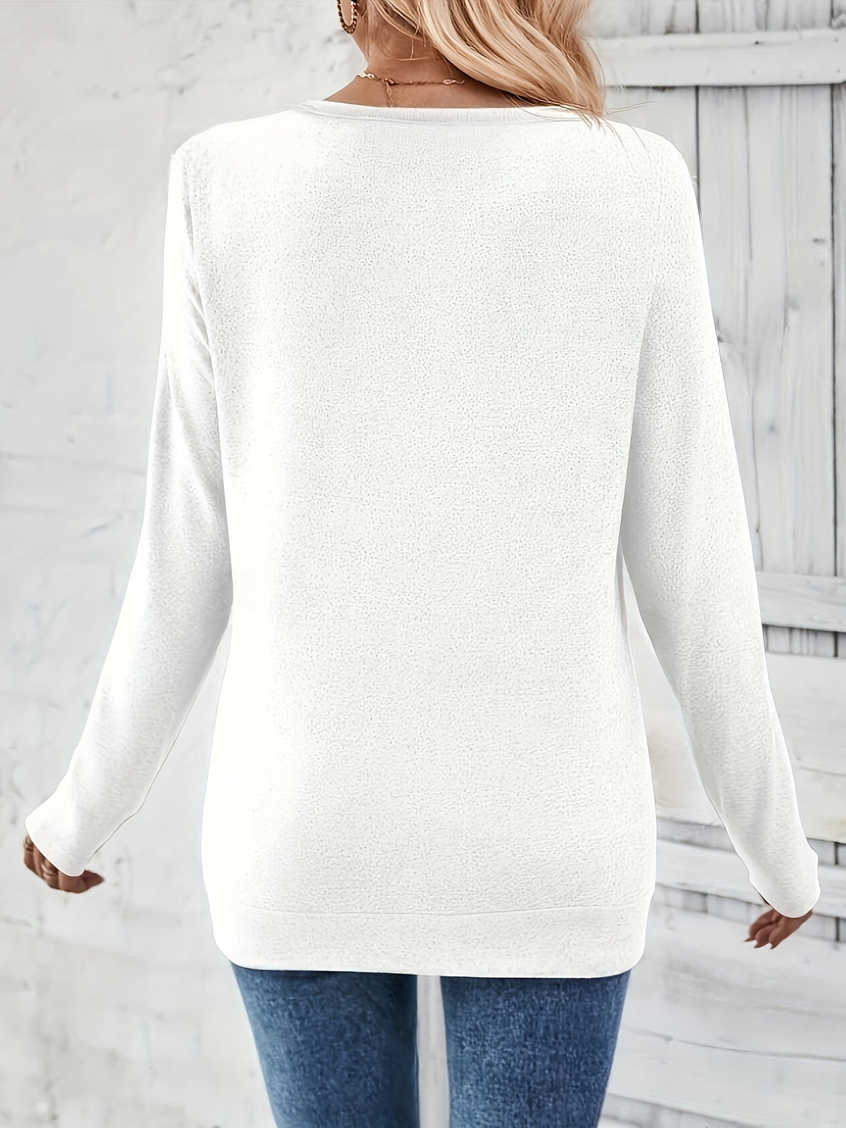 White women’s V-neck long-sleeve sweater from back