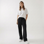 Unisex baggy joggers in black with drawstring waist, side pockets, and relaxed fit