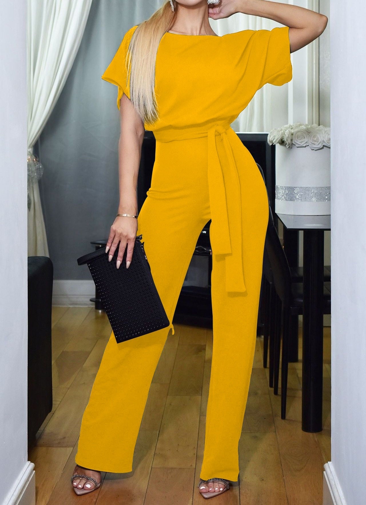 Yellow high-waist jumpsuit with short sleeves and tie waist sash, wide legs