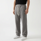 Unisex baggy joggers in gray with drawstring waist, side pockets, and star detail