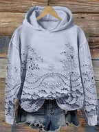Light blue floral-embroidered hoodie with scalloped lace hem.