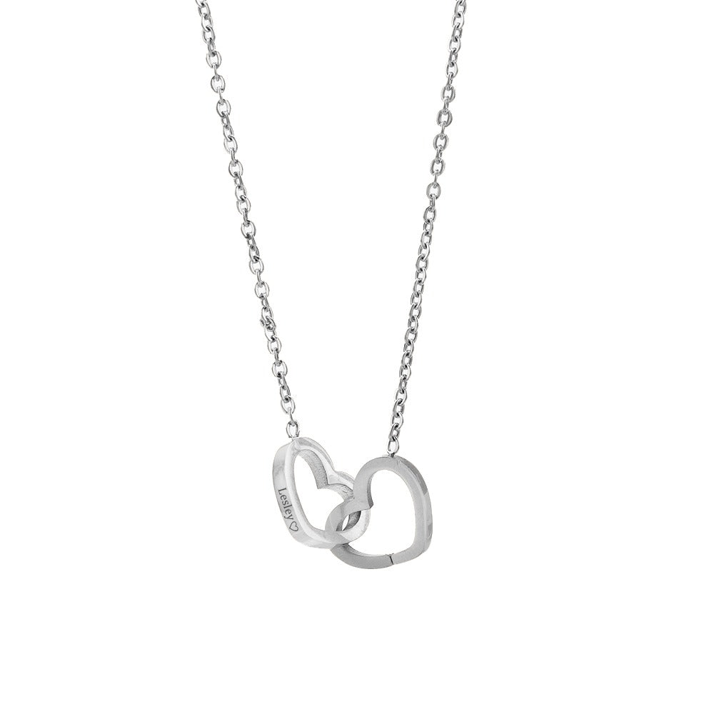 Silver heart pendant necklace with small linked chain, openwork double-heart design