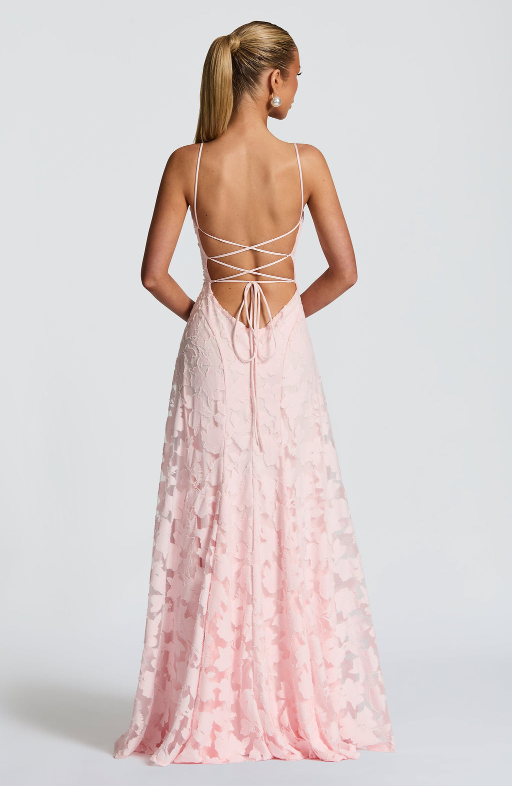 Light pink maxi evening dress with spaghetti straps and crisscross open back