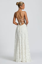 White maxi evening dress with spaghetti straps and crisscross open back