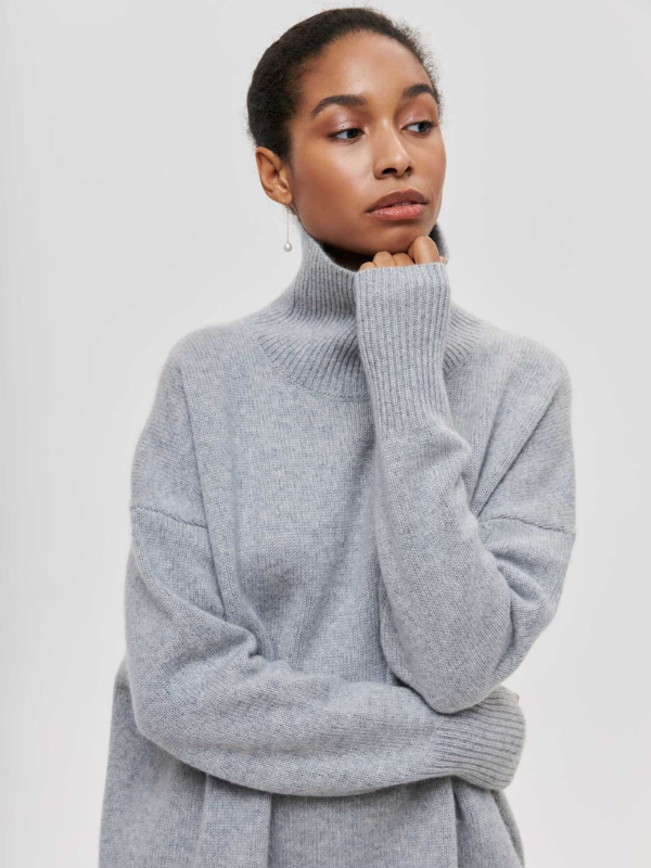 Gray knitted turtleneck sweater with long sleeves and ribbed high neck