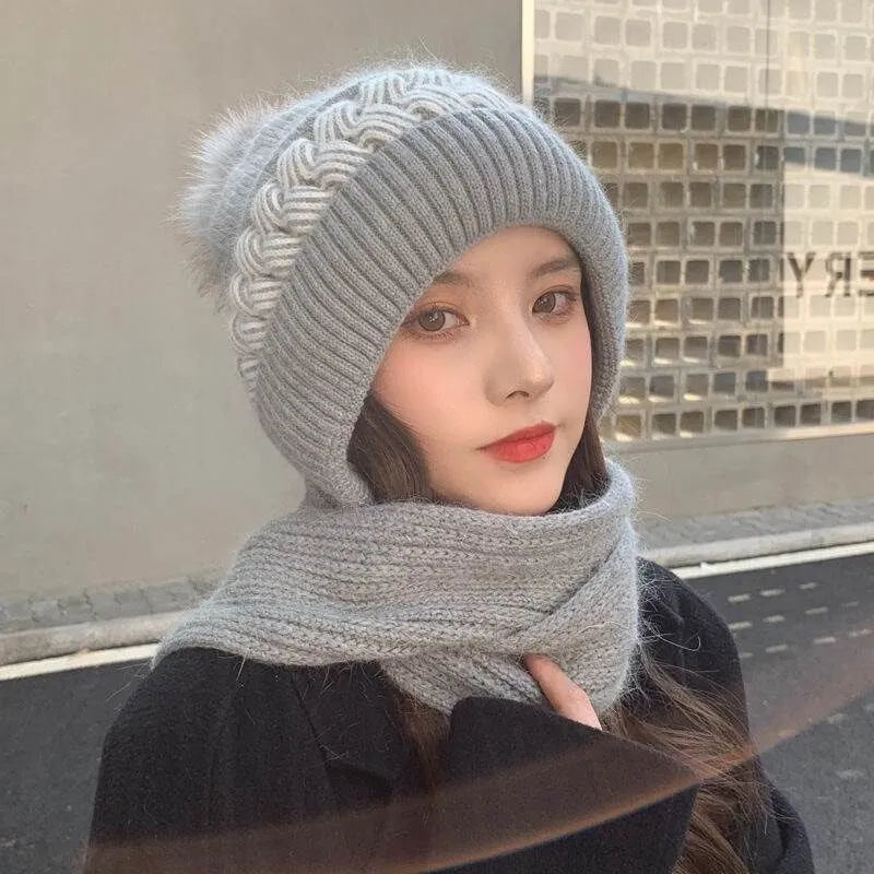 Gray knit beanie and infinity scarf set with swirl ribbing and faux-fur pom-pom