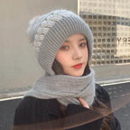 Gray knit beanie and infinity scarf set with swirl ribbing and faux-fur pom-pom