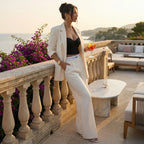 Cream tailored blazer with open front and wide-leg pants, side view