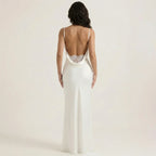 White backless sleeveless ruched maxi dress with thin straps and lace-trimmed back