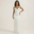 White sleeveless ruched maxi dress with square neckline, fitted bodycon silhouette