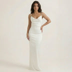 White sleeveless ruched maxi dress with square neckline, fitted bodycon silhouette