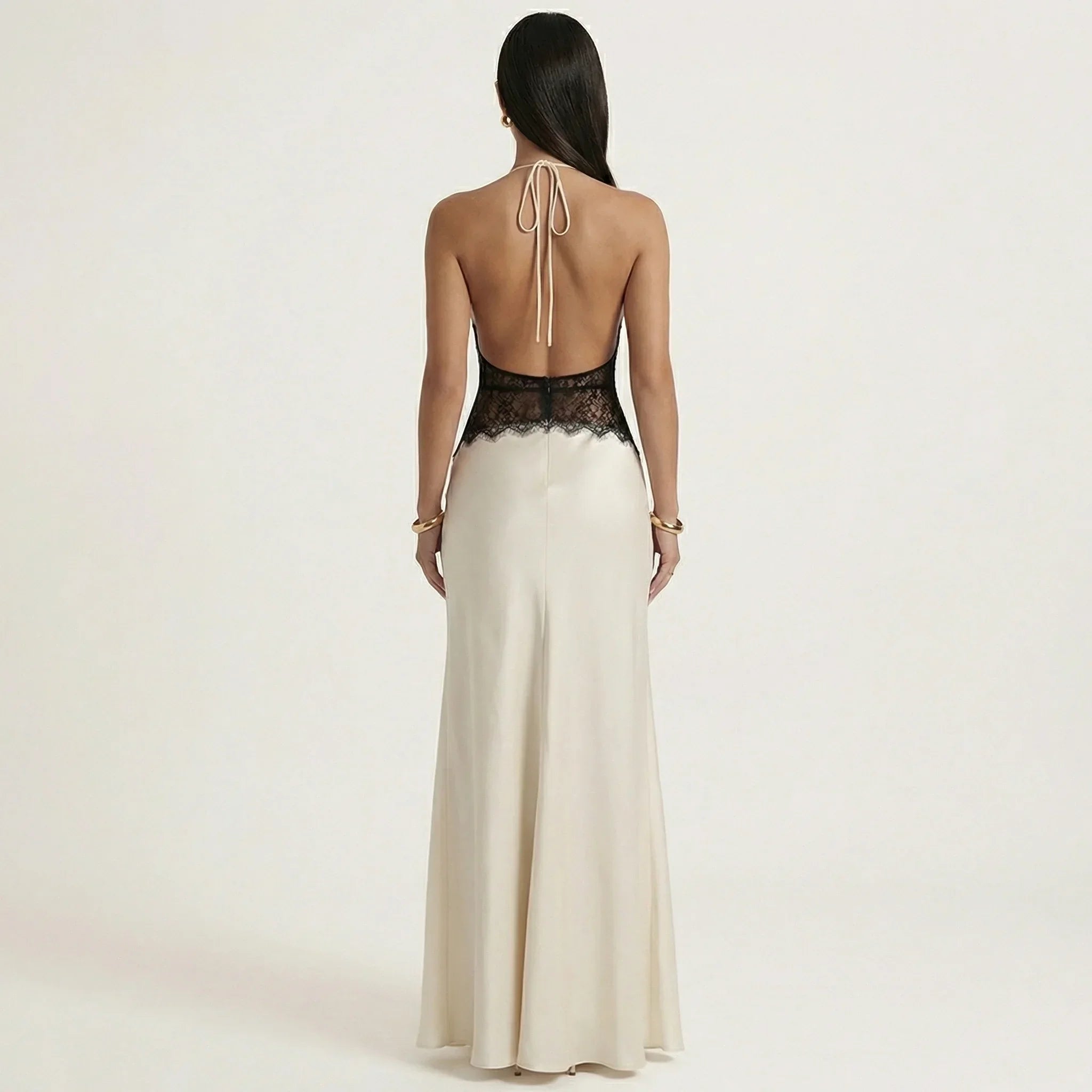 Cream backless halter maxi dress with black lace upper back and open tie straps.
