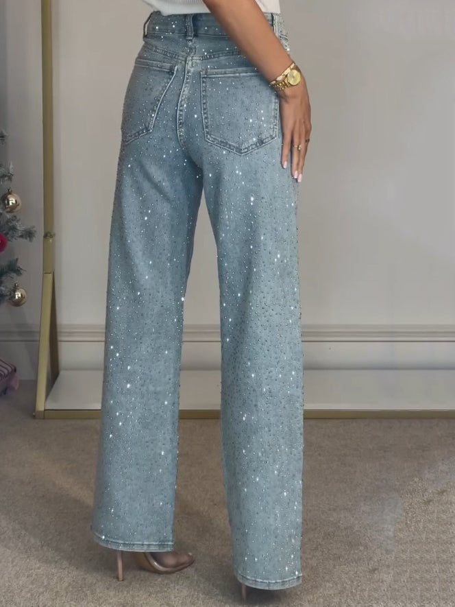 Light blue high-waist wide-leg jeans with allover glitter specks and back yoke.