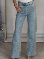 Light blue high-waist wide-leg jeans with subtle sparkle, front button and zipper.