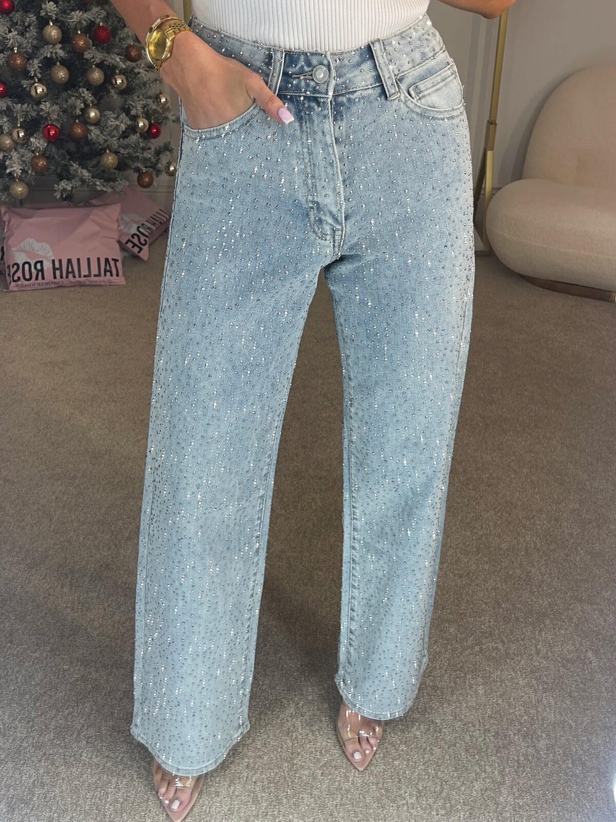 Light blue high-waist wide-leg denim jeans with shimmering dots and front belt loops.