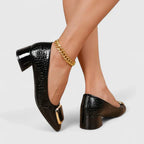 Women's black croc-texture loafers with gold buckle strap and block heel, slip-on