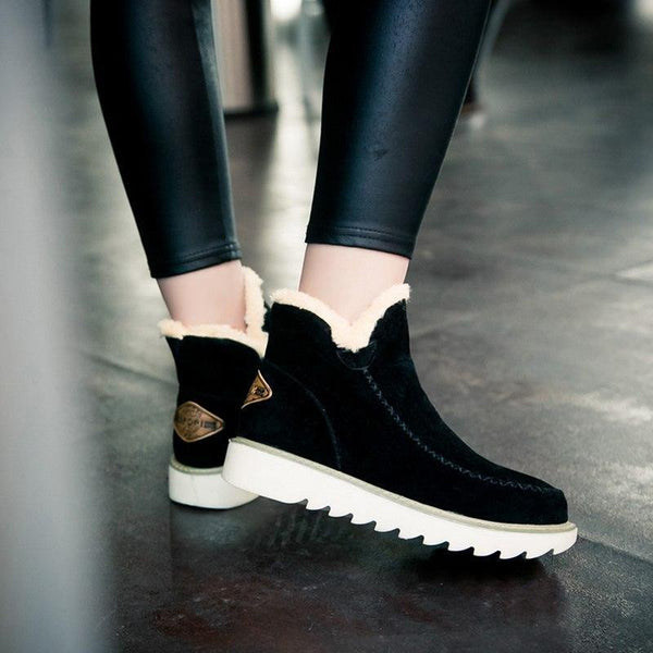 Women’s black ankle platform boots with sherpa cuff, white sole, side logo patch