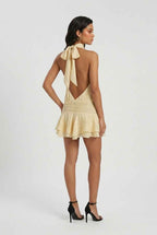 Women’s light yellow mini dress, open back with bow tie and tiered ruffle skirt