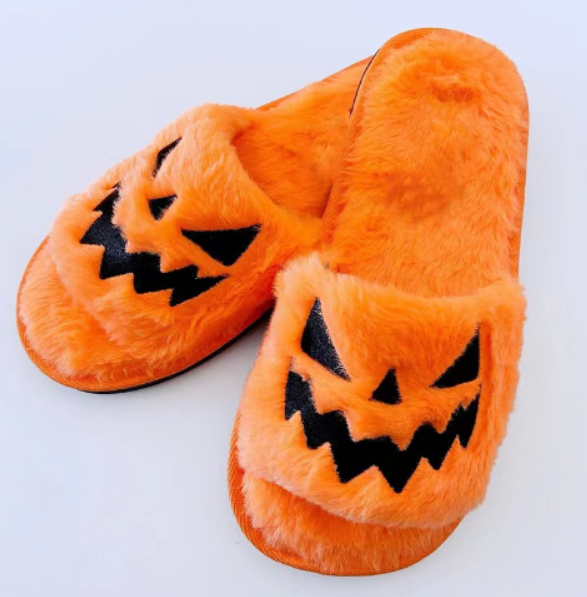 Women's orange plush Halloween jack-o-lantern slide slippers with black face appliques