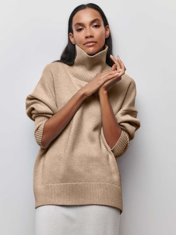 Beige knitted turtleneck sweater with long sleeves and ribbed cuffs