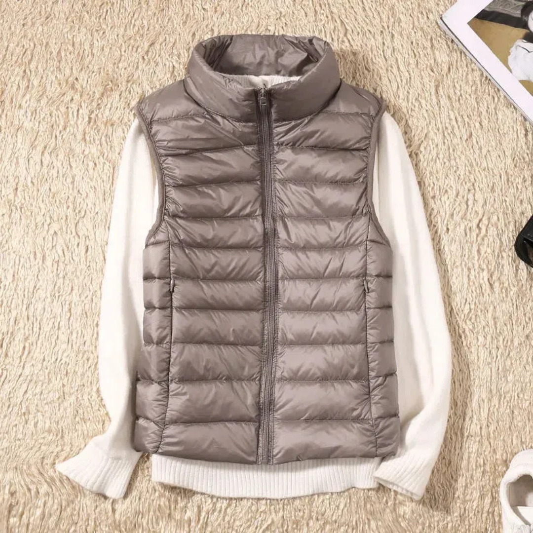 Ultralight quilted bodywarmer in gray, sleeveless, full-zip with stand collar