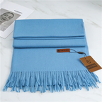 Light blue cashmere scarf with long fringes, folded