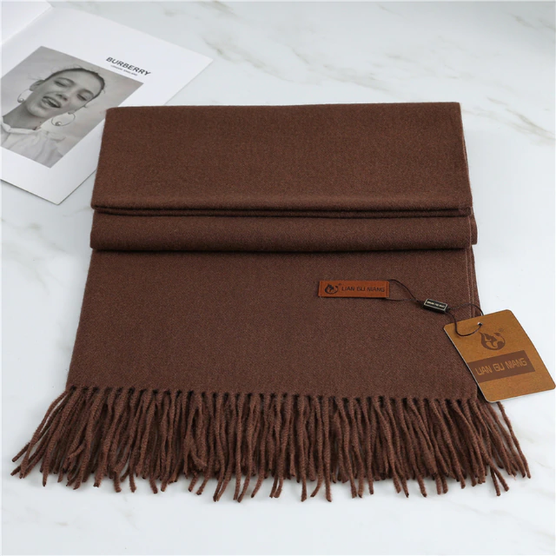 Brown cashmere scarf with fringed ends, folded and stacked