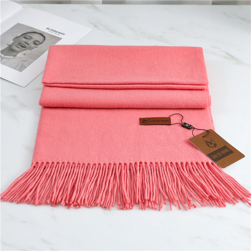 Pink cashmere scarf with long fringed hem and attached tag