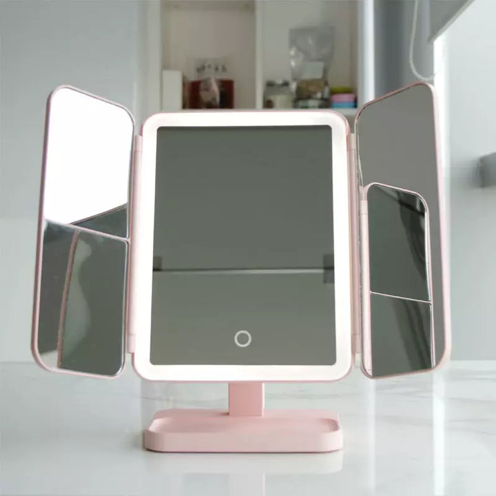 Pink LED makeup mirror on base with two side light panels and central display glass