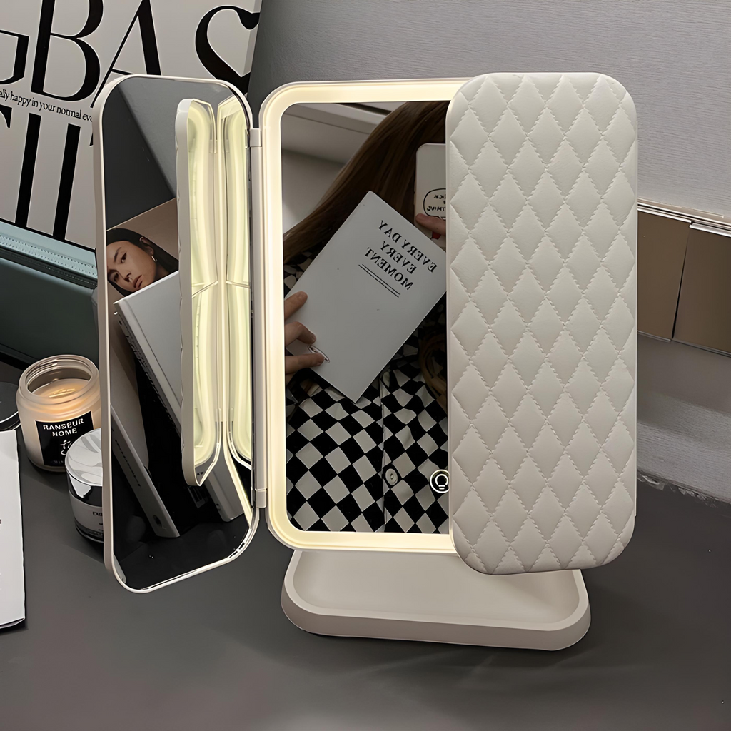 White LED makeup mirror with triple side lights and quilted storage cover on stand